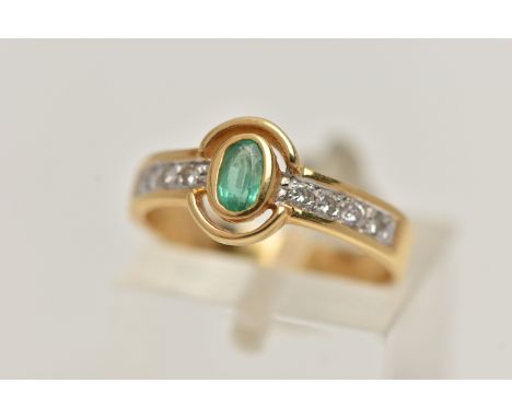 AN 18CT GOLD EMERALD AND DIAMOND RING, designed as a central oval emerald flanked by brilliant cut diamond set shoulders, est