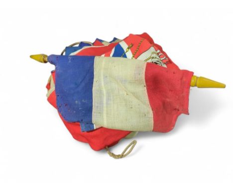 A large early 20th Century Union flag together with various others together with a Victorian oil lamp with wrythen glass rese