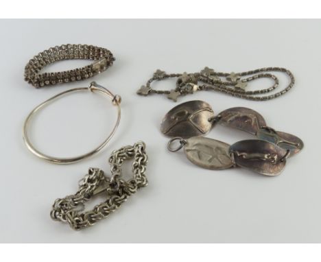 An expanding bangle marked '925', an unusual bracelet with irregular panels decorated with animals including a giraffe, eleph