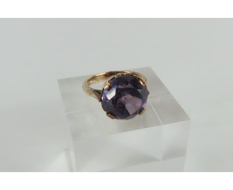 A single synthetic colour change sapphire cocktail ring, finger size K, 4.41g gross, acid tests as approximately 9ct gold, in