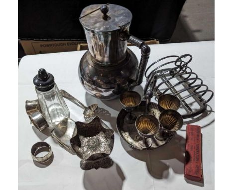 A collection of silver and silver-plated items, including a toast rack, hot-water pot, spoon, cup holder, cigarette case and 