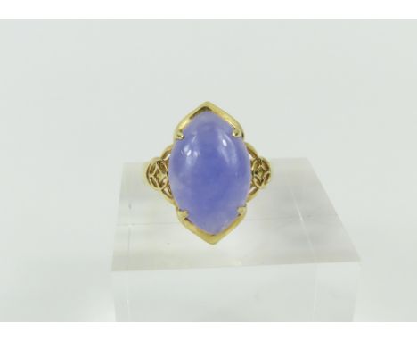 A 9ct gold lilac jade dress ring, the cabochon cut stone to a decorative setting, finger size M, 3.71g gross (please note thi