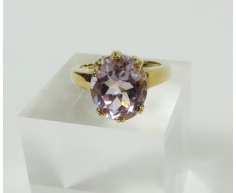 A 9ct gold kunzite dress ring, the oval facetted stone in double claw settings, finger size N, 4.62g gross