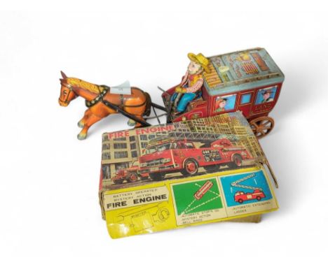 A Japanese battery operated tinplate fire engine in original box together with another Japanese battery operated toy "Overlan