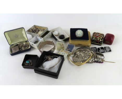 A silver vesta, a silver charm bracelet and a silver Victorian brooch, together with various other items of silver jewellery,