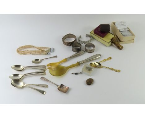 Two silver napkin rings, pair of silver handled and horn salad servers, a Park Lane compact bag, plated teaspoons and costume