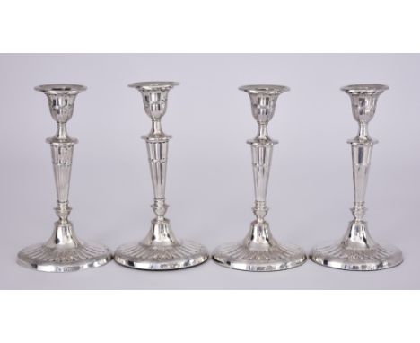 A Set of Four Victorian Silver Pillar Candlesticks, by William Hutton &amp; Sons, London 1893, of oval fluted classical form 