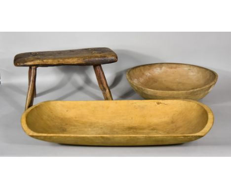 A 19th Century Primitive Elm Stool,&nbsp;18ins x 8ins x 9.5ins high, a sycamore dairy bowl, 16.5ins diameter, and a wooden tr