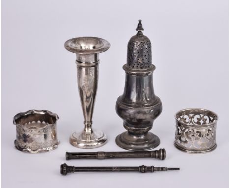 A George III Silver Caster and Mixed Silver, the caster by I.D., London 1764, with acorn pattern finial , moulded girdle to b