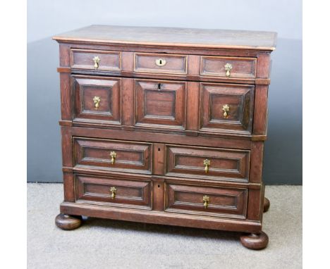 A Late 17th Century Panelled Oak Chest In Two Sections, with moulded edge to top, fitted four long drawers with geometric mou