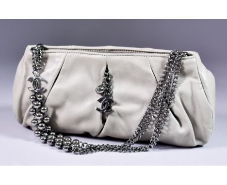 A Chanel Grey Pleated Lambskin Flap Bag, with chain link shoulder straps, 11ins wide 6ins high, with card of authenticity, wi