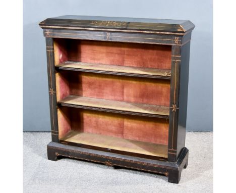 A Victorian Ebonised and Inlaid Dwarf Bookcase, with angled top, inlaid with arabesques, fitted three open shelves, on plinth