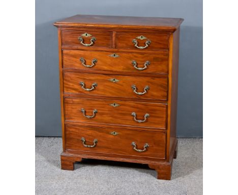 A George III Mahogany Chest, with moulded edge to top, fitted two short and four long graduated drawers, on bracket feet, 29i