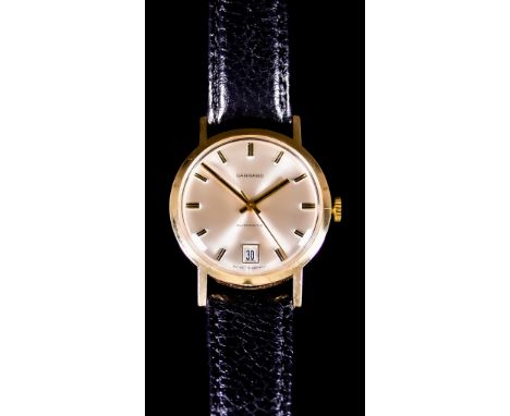 A Gentleman's Automatic Wristwatch, by Garrard of London, 9ct gold case,&nbsp;34mm diameter,&nbsp;champagne dial with black b