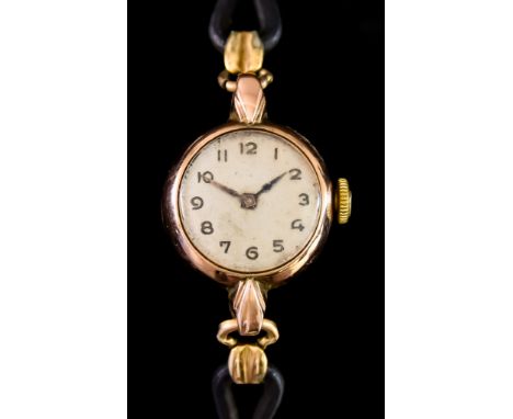 A Lady's 9ct Manual Wind Wristwatch, 9ct gold case,18mm diameter, silver dial with black Arab baton numerals on cord and base