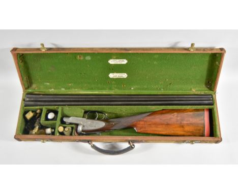 A 12 Bore Side by Side Shotgun, by E J Churchill of London, Model XXV, Serial No. 4979, marked number 1 of pair, 25ins blued 