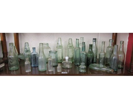 Shelf of old glass bottles