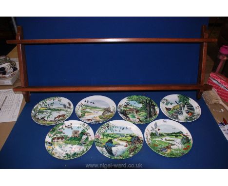 Seven Wedgwood limited edition display Plates with 'Colin Newman's river panorama' with display shelf