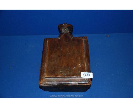 A carved wood trinket Box with sliding door panel and three compartments, 12'' x 7''.