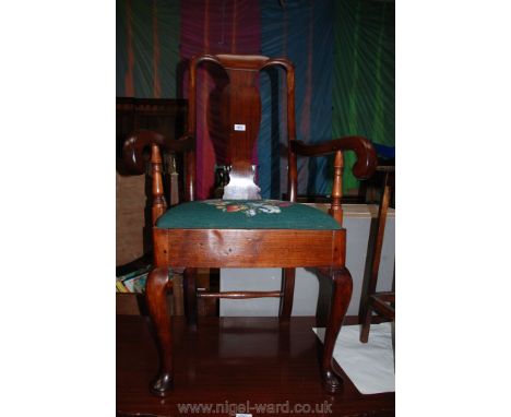 An elegant Mahogany framed Elbow Chair having shaped splat scroll arms, standing on cabriole legs and having drop-in tapestry