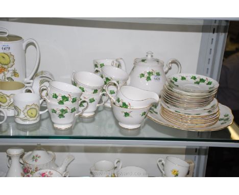 A 26 piece Colclough Teaset in gold and ivy leaf pattern, consisting of teapot, sugar bowl, milk jug, eight cups, eight sauce