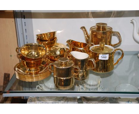 A Royal Winton gold coloured Teaset including cake plate, six cups and saucers, six side plates, milk jug and sugar bowl, a G