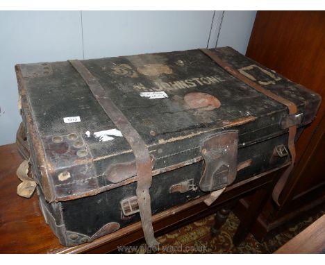 A well travelled leather bound canvas travel Trunk with leather binding straps and lift out tray, 36" x 22 1/2" x 11 1/2" hig