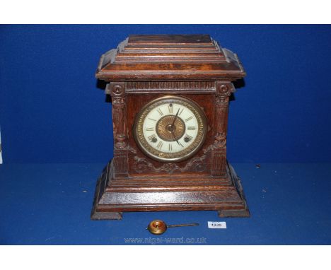 An American 'Sharon' mantle Clock with pillar columns and Roman numerals, eight day movement with pendulum, key missing, 11''