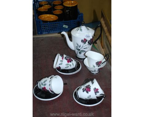 A Royal Albert 'Masquerade' coffee service, including coffee pot, six cups, six saucers, milk jug, sugar bowl, one cup with s