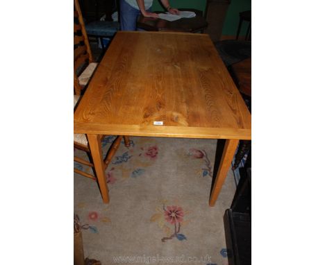 A mixed light hardwoods scrubbed top Table standing on square legs, 54'' x 32'' x 28 1/2'' high