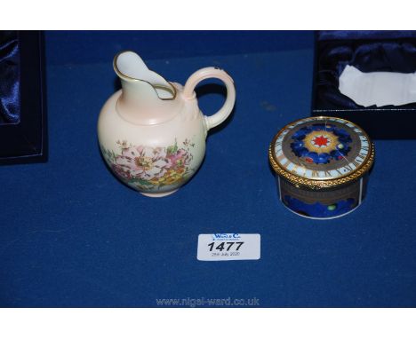 A boxed Royal Worcester commemorative jug 'Blush Ivory Flat Back' and a musical Millennium trinket pot, lid cracked.