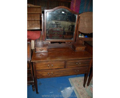 An early 20th c. Mahogany Dressing Table having rope style stringing, bevelled swing mirror, two trinket drawers and two long