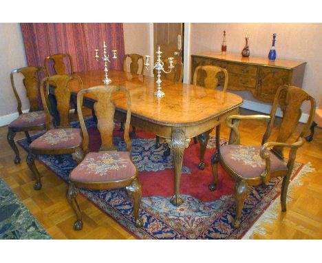 A set of eight Walnut Queen Anne style Dining Chairs including two carvers and six dining chairs having attractive tapestry s