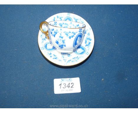 A Coalport miniature cup and saucer decorated in blue with portrait cameos, pattern no. A839(1?).
