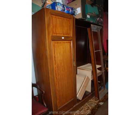 A good quality Edwardian cross-banded and light/dark wood strung Mahogany triple Wardrobe having to the left a flight of thre