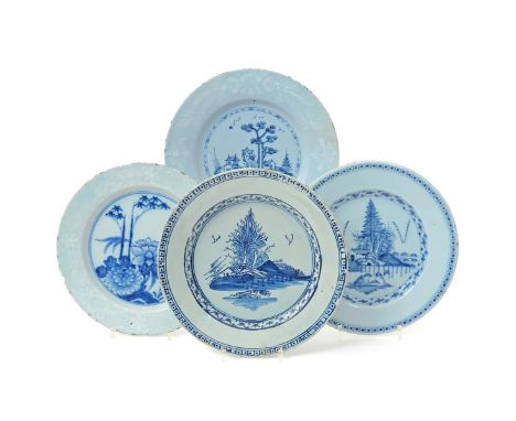 Four Bristol delftware plates  c.1760-70, one painted with chrysanthemum and bamboo, another with a tall pine tree beside roc