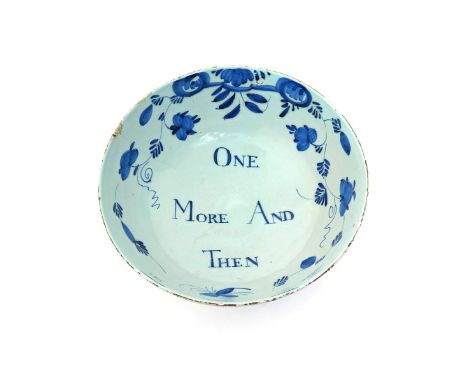 An English delftware punchbowl  c.1760, the exterior painted with stylized fruiting branches in the Chinese manner, the inter