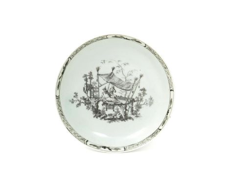 A Worcester saucer  c.1758-60, printed in black with La Siesta, a Chinese figure recumbent beneath a tall canopy, with a furt
