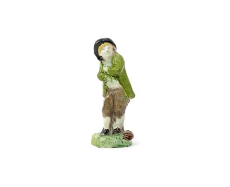 A Ralph Wood figure of a young chimney sweep c.1770-80, probably modelled by John Voyez after Paul-Louis Cyfflé, standing wit