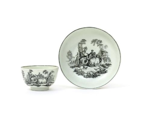 A Worcester teabowl and saucer  c.1765, printed in black with L'Amour, a courting couple on a garden bench with a maid chaper