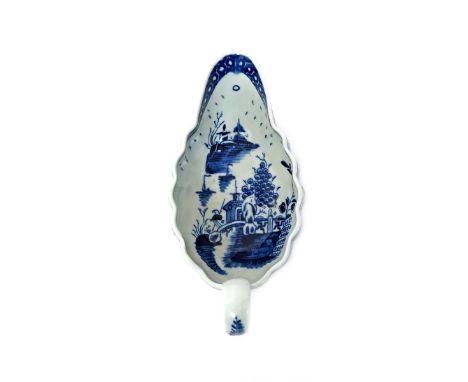 A Worcester blue and white sauceboat  c.1775, of shallow fluted form, painted to the interior with the Full Moon pattern bene