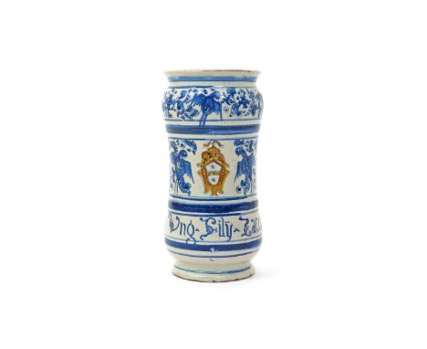 An Italian (Deruta) maiolica armorial albarello  c.1650, painted with a small heraldic shield of a blue star either side of a