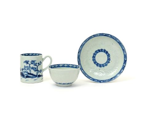 A Worcester blue and white teabowl and saucer  c.1758, finely moulded with a continuous floral design within a hatched diaper