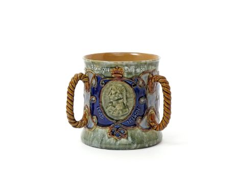 A Royal Doulton commemorative tyg  c.1905, the generous cylindrical body applied with three rope handles, one side moulded wi