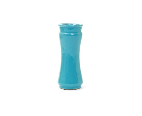 A Spanish maiolica albarello  18th century, the narrow waisted form decorated in a rich monochrome turquoise glaze, echoed to