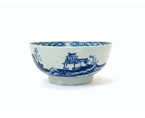 A Worcester blue and white punch bowl  c.1770, painted with the Precipice pattern, depicting pagodas on a clifftop amidst pin