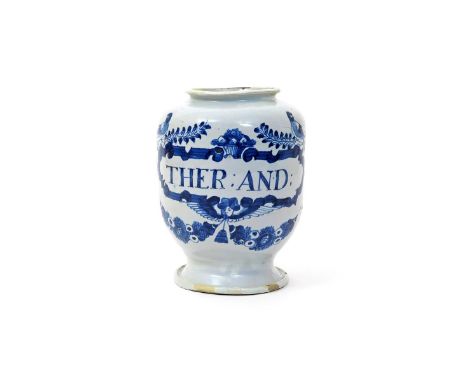 A London delftware dry drug jar  1st half 18th century, painted in blue with a cartouche titled 'THER: AND:' above a winged m