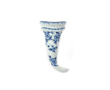 A Worcester blue and white wall pocket  c.1755-58, the spiral-moulded body of cornucopia form and painted with flowering prun