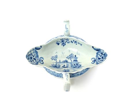 A Worcester blue and white two-handled sauceboat  c.1756, painted with the Two-Handled Sauceboat pattern, the interior with a
