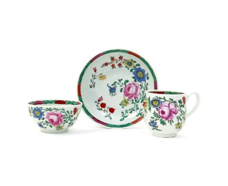 A good Worcester trio  c.1765, comprising a teabowl, coffee cup and saucer, brightly painted in the Meissen manner with large